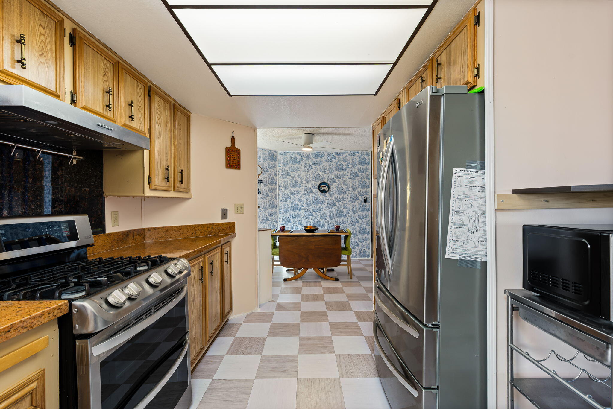 33204 Laredo Circle Thousand Palms, CA 92276 - Photo 29 of 62 a kitchen with stainless steel appliances granite countertop a refrigerator and a stove
