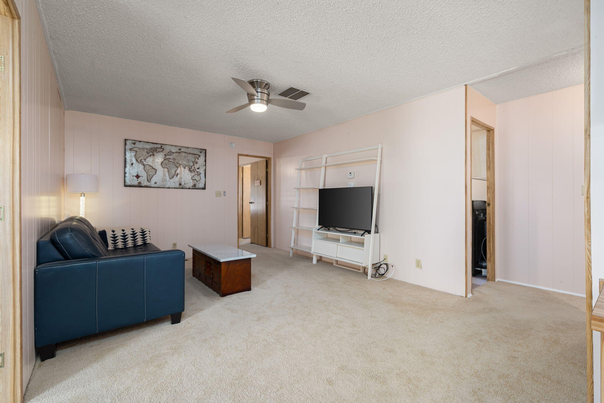 33204 Laredo Circle Thousand Palms, CA 92276 - Photo 36 of 62 a view of a livingroom with furniture and a flat screen tv