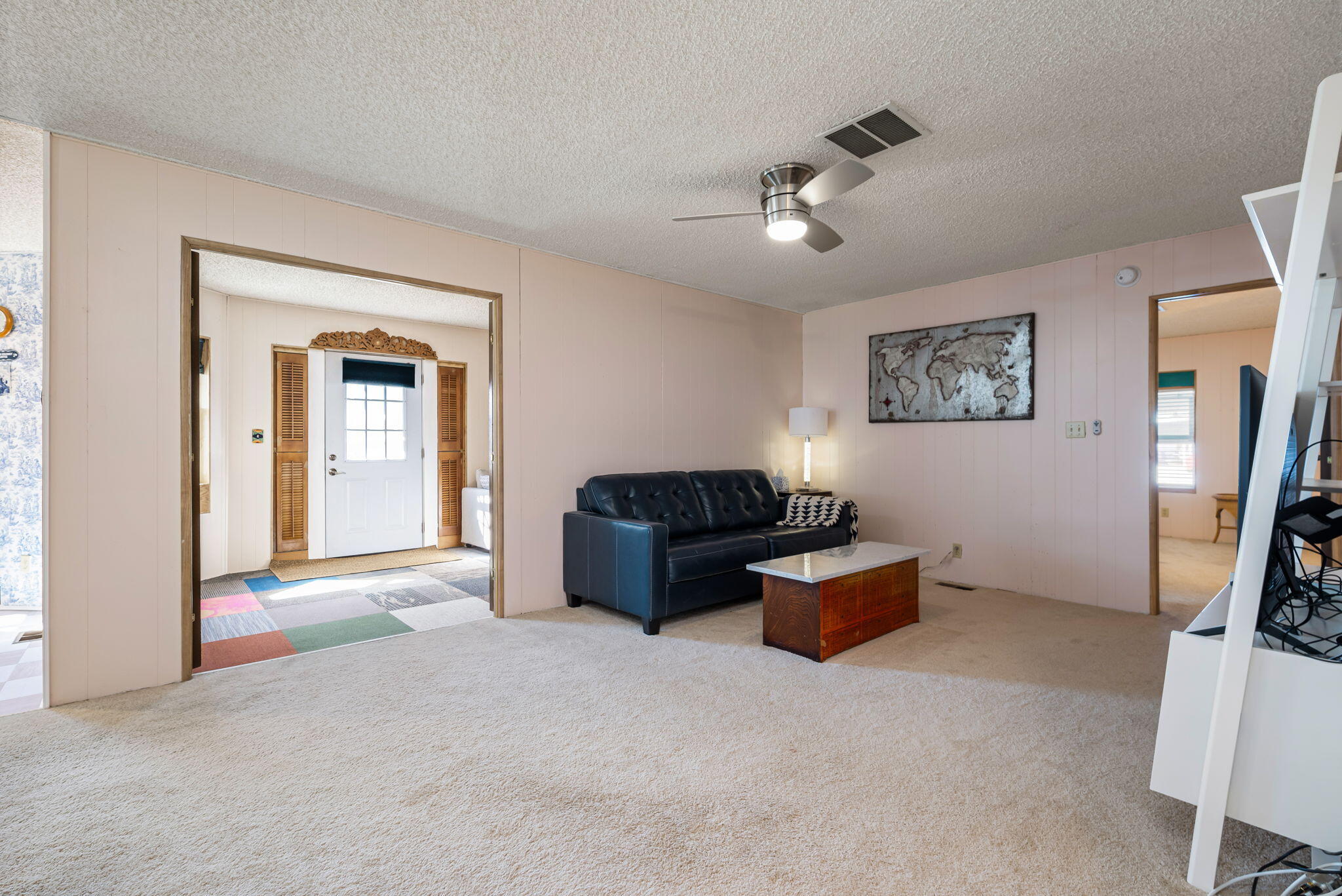 33204 Laredo Circle Thousand Palms, CA 92276 - Photo 37 of 62 a living room with furniture and a ceiling fan