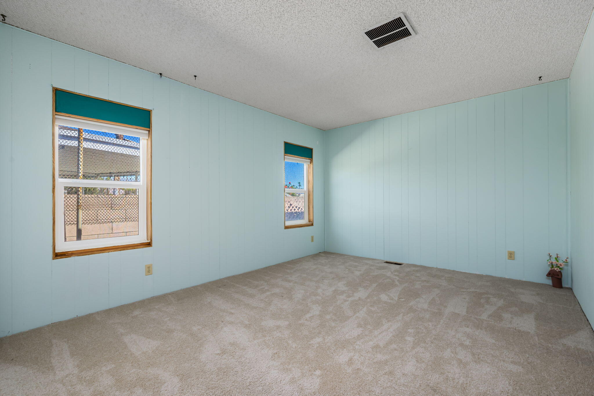 33204 Laredo Circle Thousand Palms, CA 92276 - Photo 46 of 62 an empty room with windows