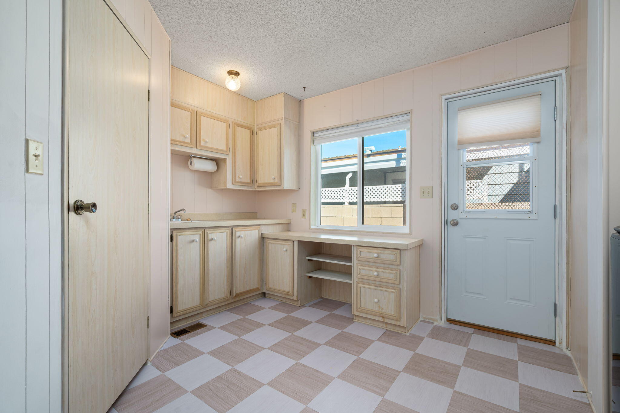 33204 Laredo Circle Thousand Palms, CA 92276 - Photo 48 of 62 a kitchen with white cabinets and appliances