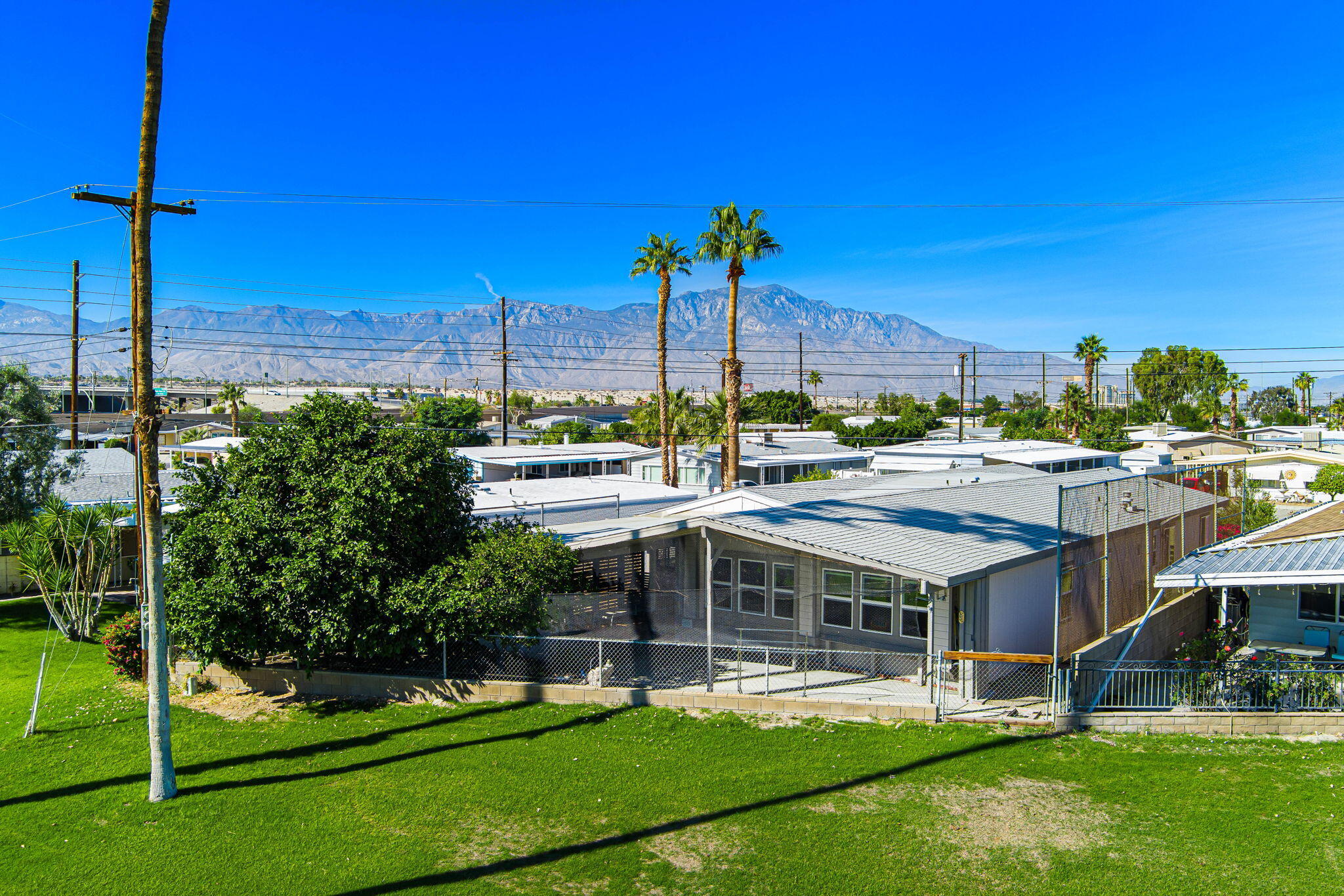 33204 Laredo Circle Thousand Palms, CA 92276 - Photo 5 of 62 a view of a patio with chairs and a yard with plants