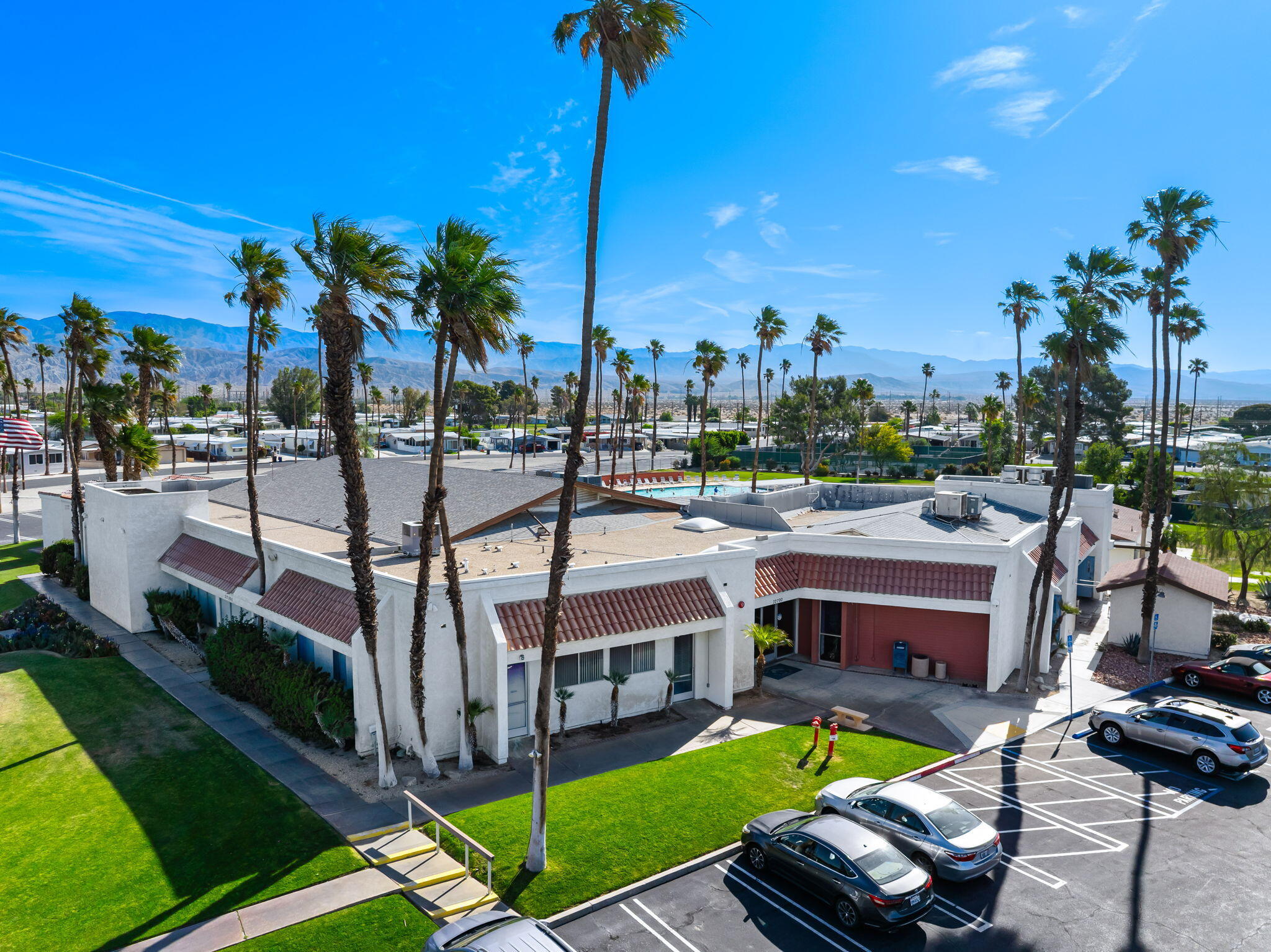 33204 Laredo Circle Thousand Palms, CA 92276 - Photo 60 of 62 a view of a swimming pool with a patio and a yard