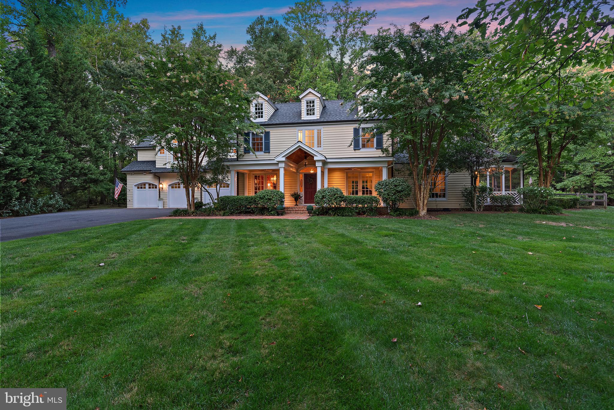 403 Beards Dock Crossing Annapolis, MD 21403 - Photo 2 of 96 a front view of a house with a garden and trees