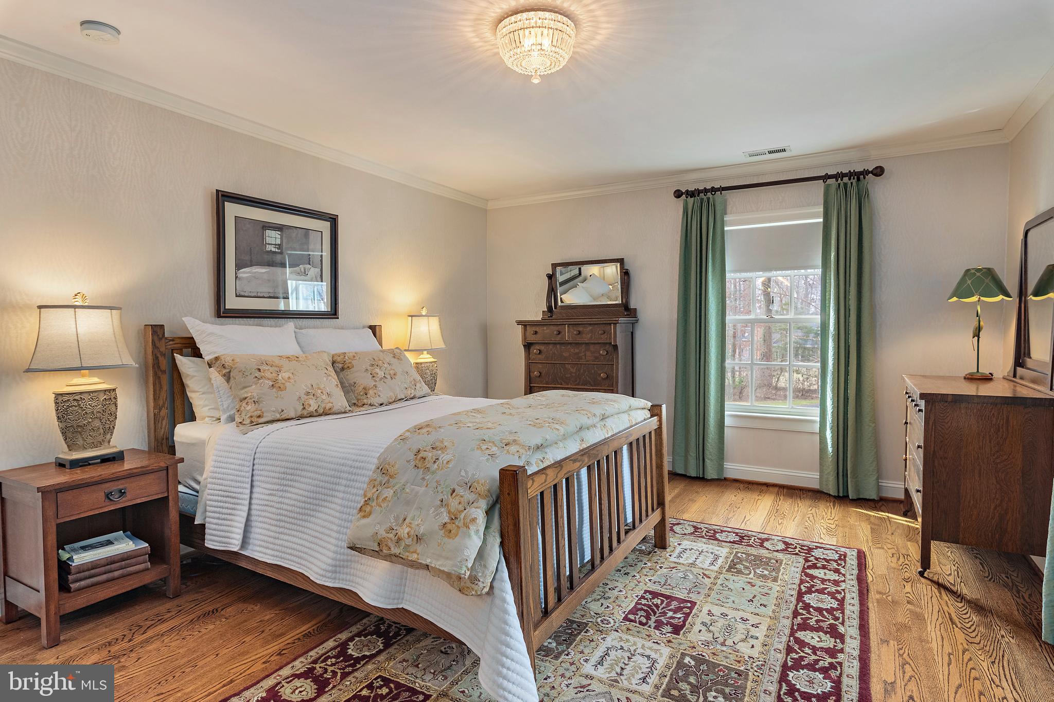 403 Beards Dock Crossing Annapolis, MD 21403 - Photo 65 of 96 a bedroom with a bed and a lamp on a dresser