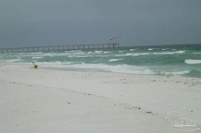 a view of beach and kitchen