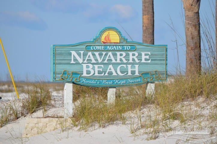 7447 Harvest Village Court Navarre, FL 32566 - Photo 27 of 27 a sign broad on the wall