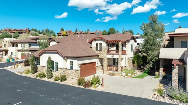 a aerial view of a house with a swimming pool