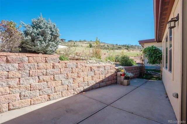 a garden view with a seating space