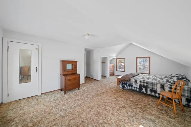 a bedroom with furniture and window