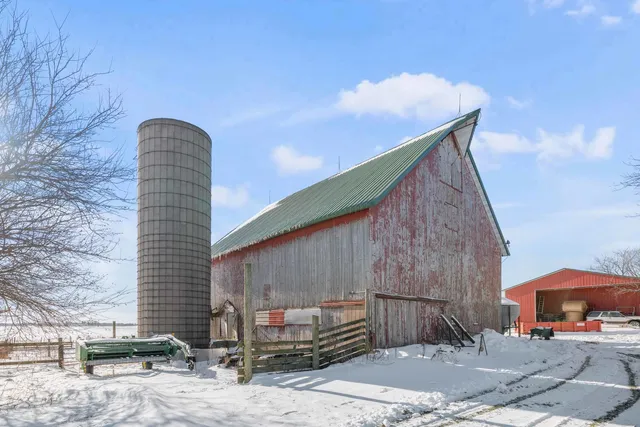 a backyard of a house with oven and barbeque oven