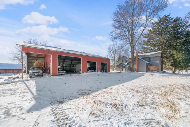 a view of a house with a snow in the yard
