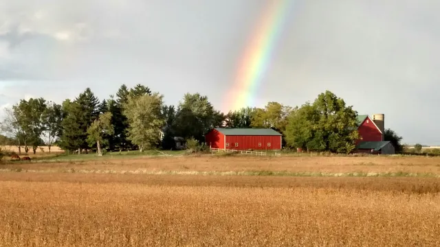 a view of a house with a yard and mountain view