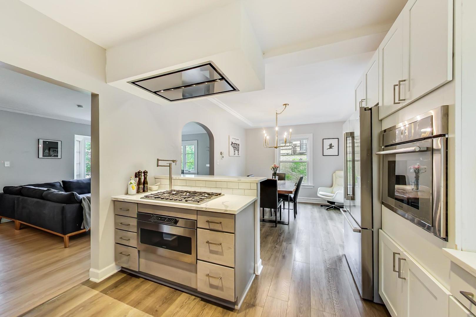 354 Longcommon Road Riverside, IL 60546 - Photo 11 of 37 a kitchen with a stove and a refrigerator