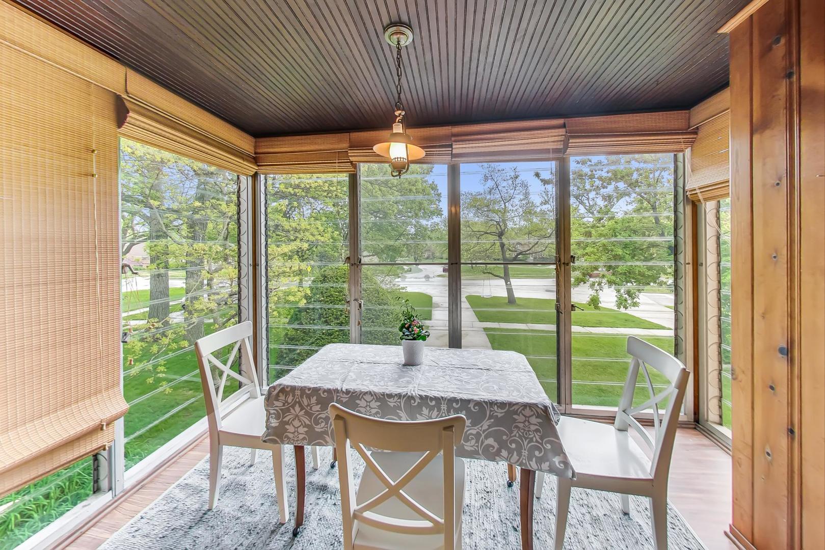 354 Longcommon Road Riverside, IL 60546 - Photo 18 of 37 a view of a dining room with furniture window and outside view