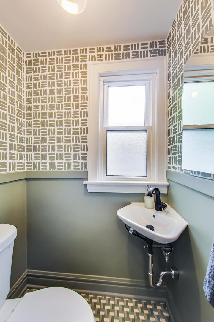 354 Longcommon Road Riverside, IL 60546 - Photo 19 of 37 a bathroom with a sink a toilet and a mirror