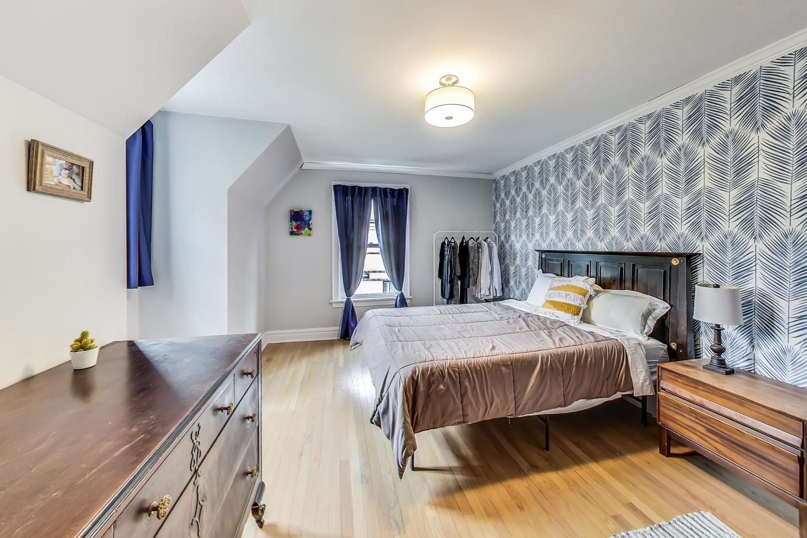 354 Longcommon Road Riverside, IL 60546 - Photo 20 of 37 a bed room with a bed and a table