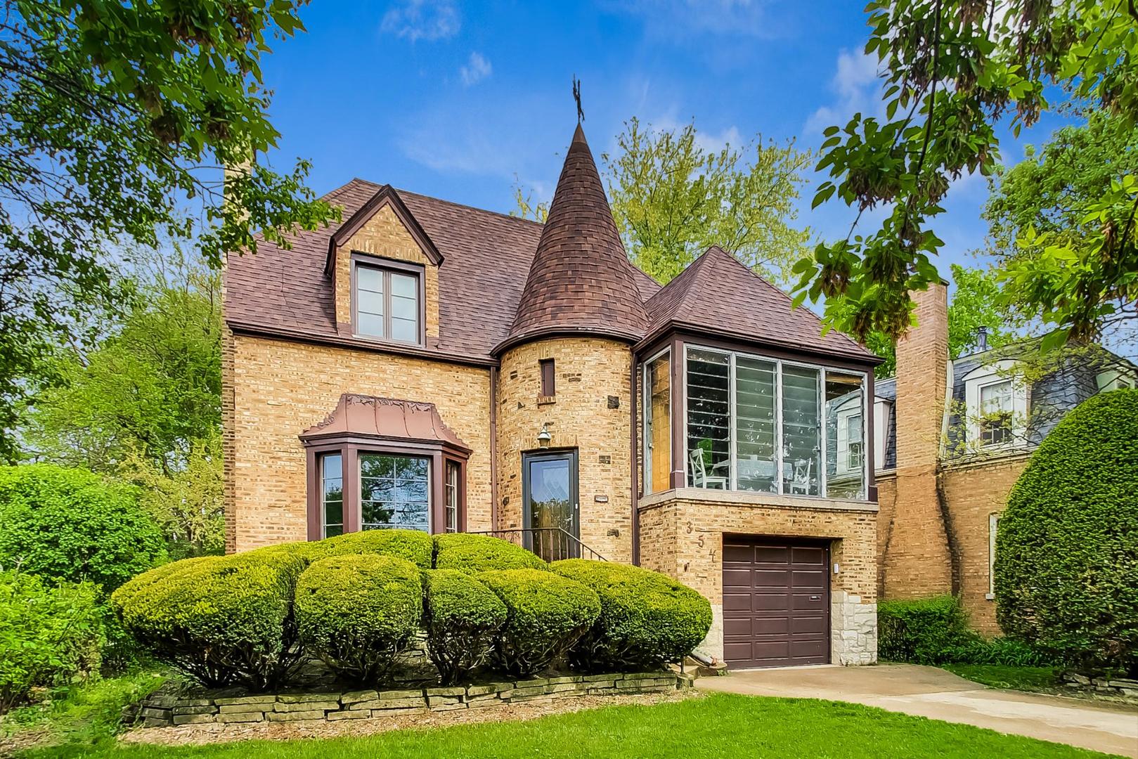 354 Longcommon Road Riverside, IL 60546 - Photo 2 of 37 a front view of a house with garden