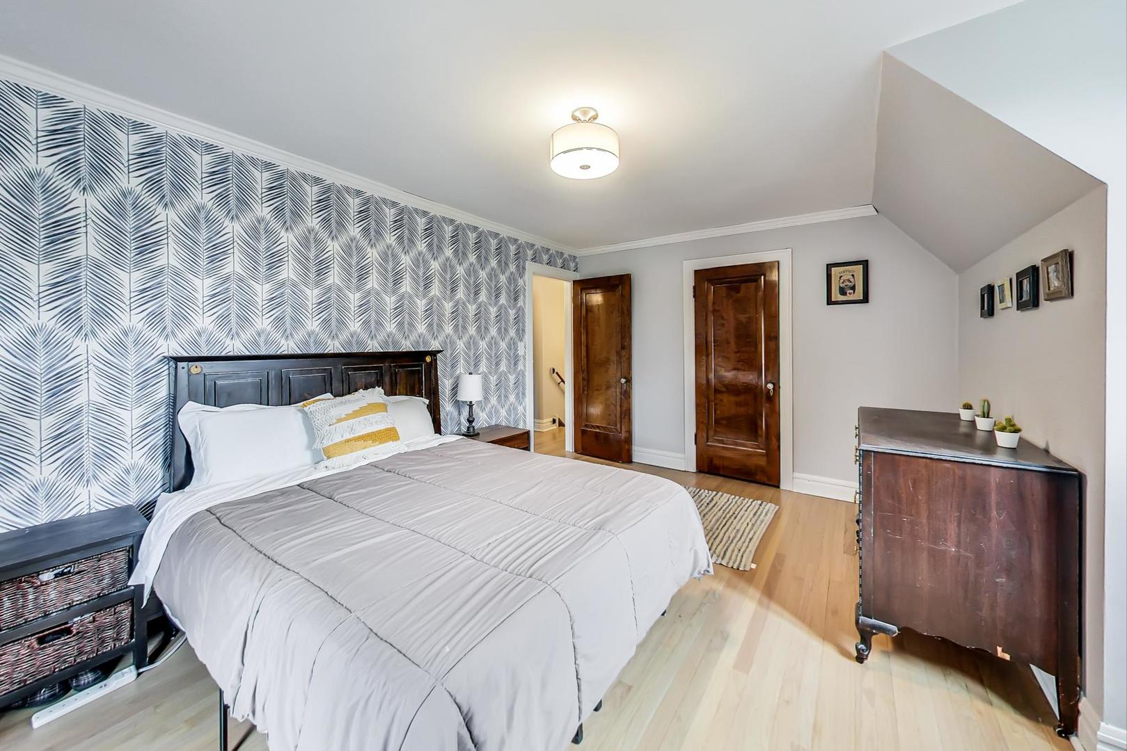 354 Longcommon Road Riverside, IL 60546 - Photo 22 of 37 a bedroom with a bed and a dresser