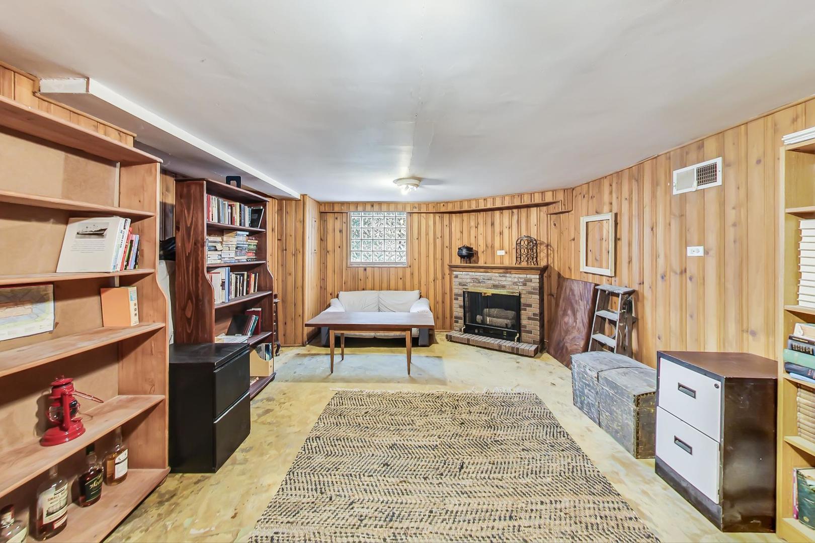 354 Longcommon Road Riverside, IL 60546 - Photo 28 of 37 a living room with fireplace furniture and a rug