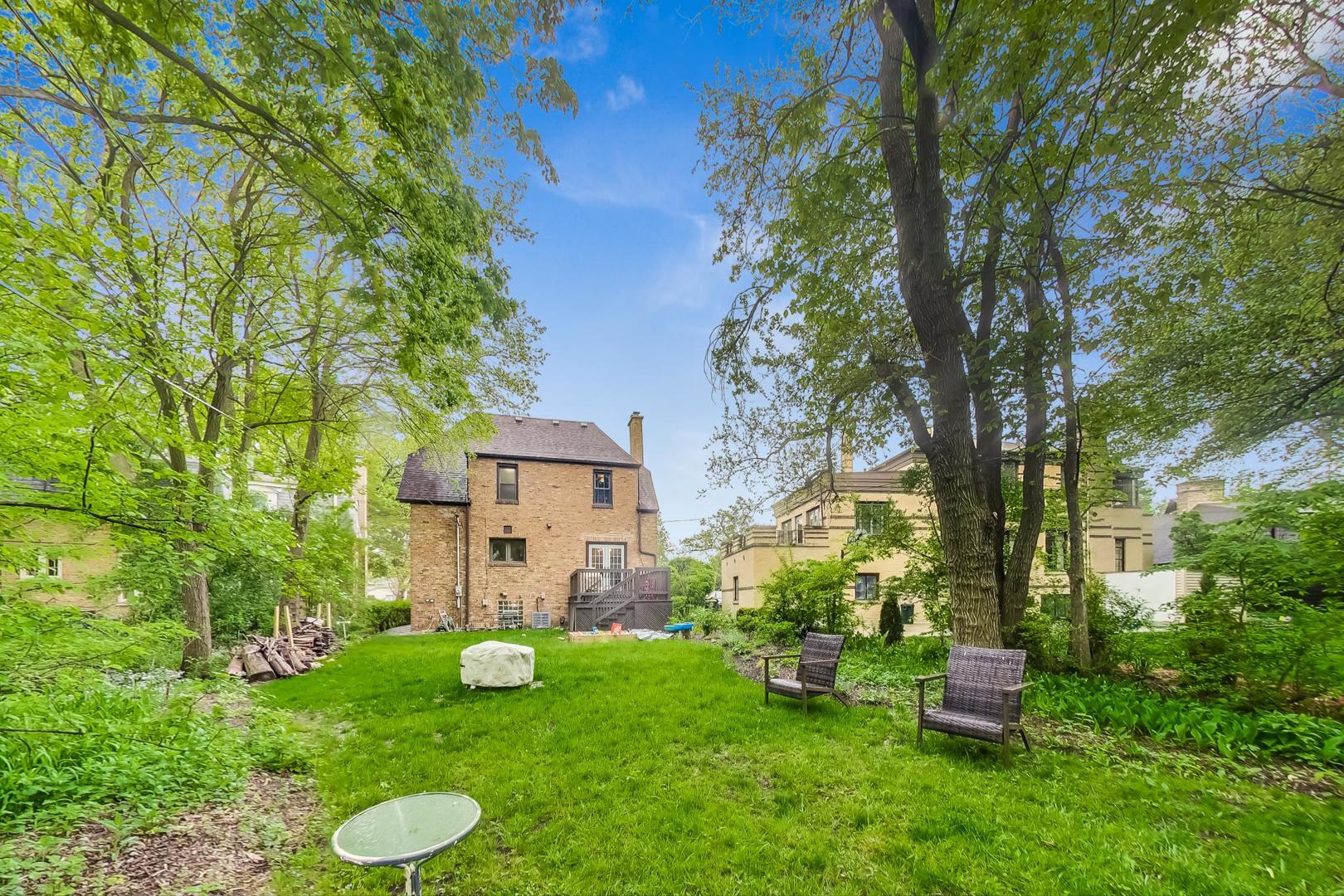 354 Longcommon Road Riverside, IL 60546 - Photo 32 of 37 a view of a chair and table in backyard of the house