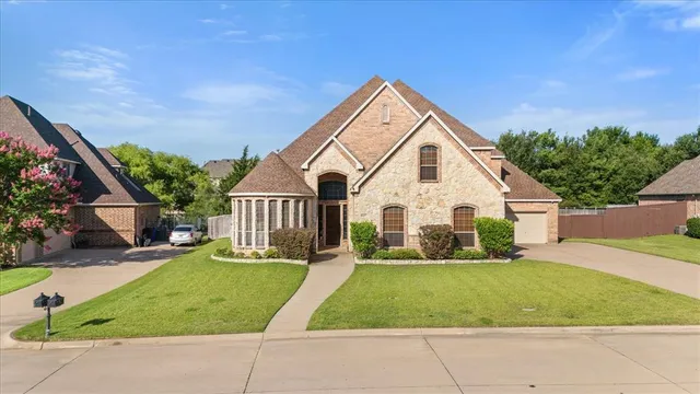 a view of house with yard and entertaining space
