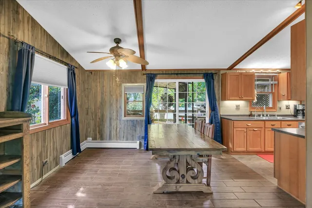 a room with granite countertop lots of counter top space and wooden floor