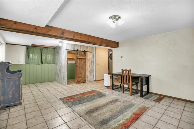 a bedroom with a bed and a table in it