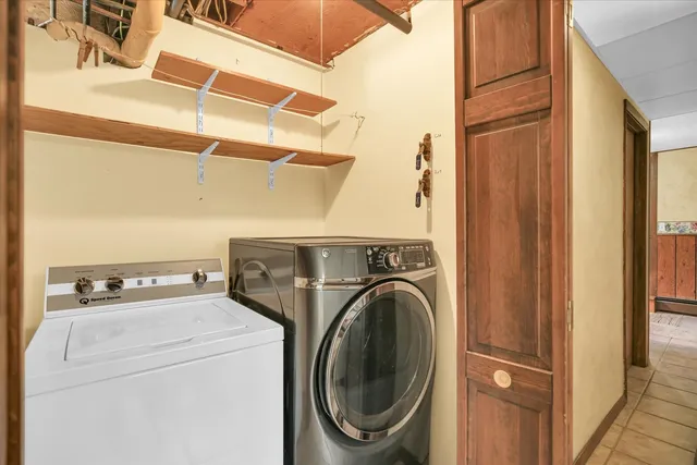 a view of a patio with a table chairs and a backyard