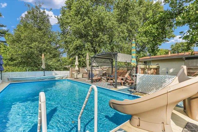 a view of a yard with large trees