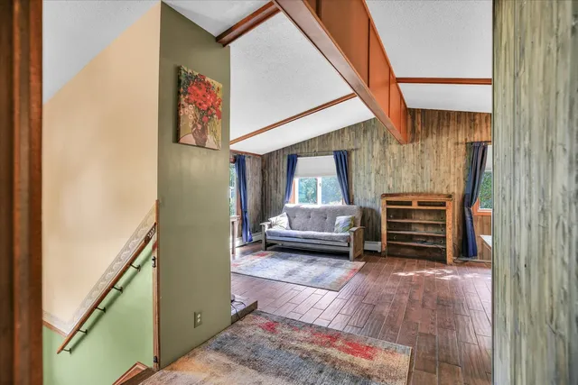 a view of living room with furniture and a window