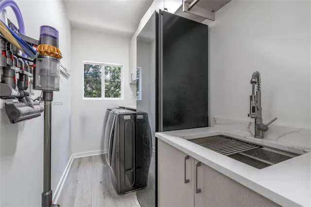 a kitchen with a refrigerator and a stove