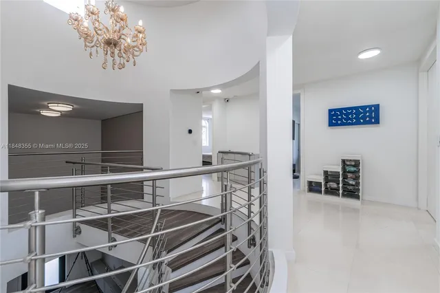 a view of kitchen with furniture and a chandelier