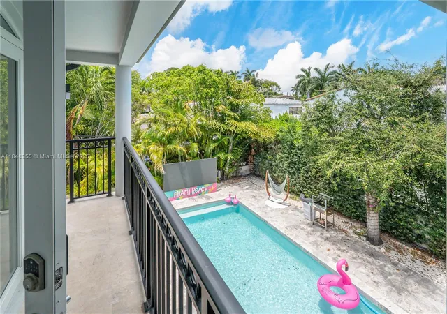 a balcony with couple of flower plants
