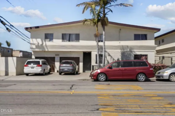 a view of a car parked in front of a building