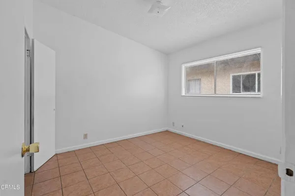 a view of an empty room with windows