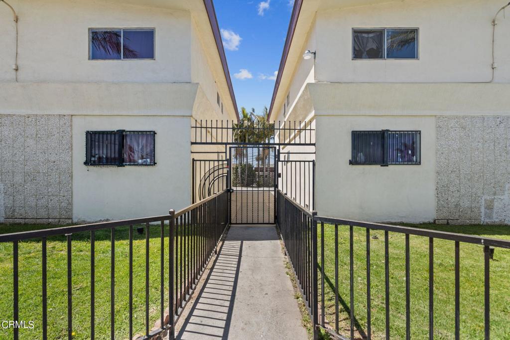 5441 Perkins Road Oxnard, CA 93033 - Photo 8 of 39 a view of a hallway with wooden floor and stairs