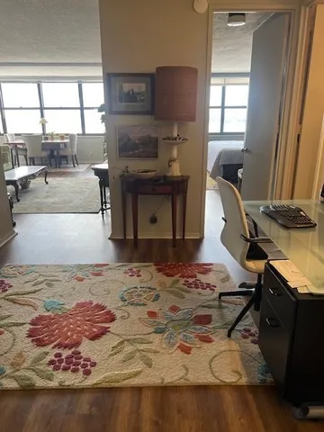 a living room filled with furniture window and a table