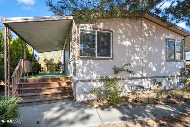 a view of house with backyard
