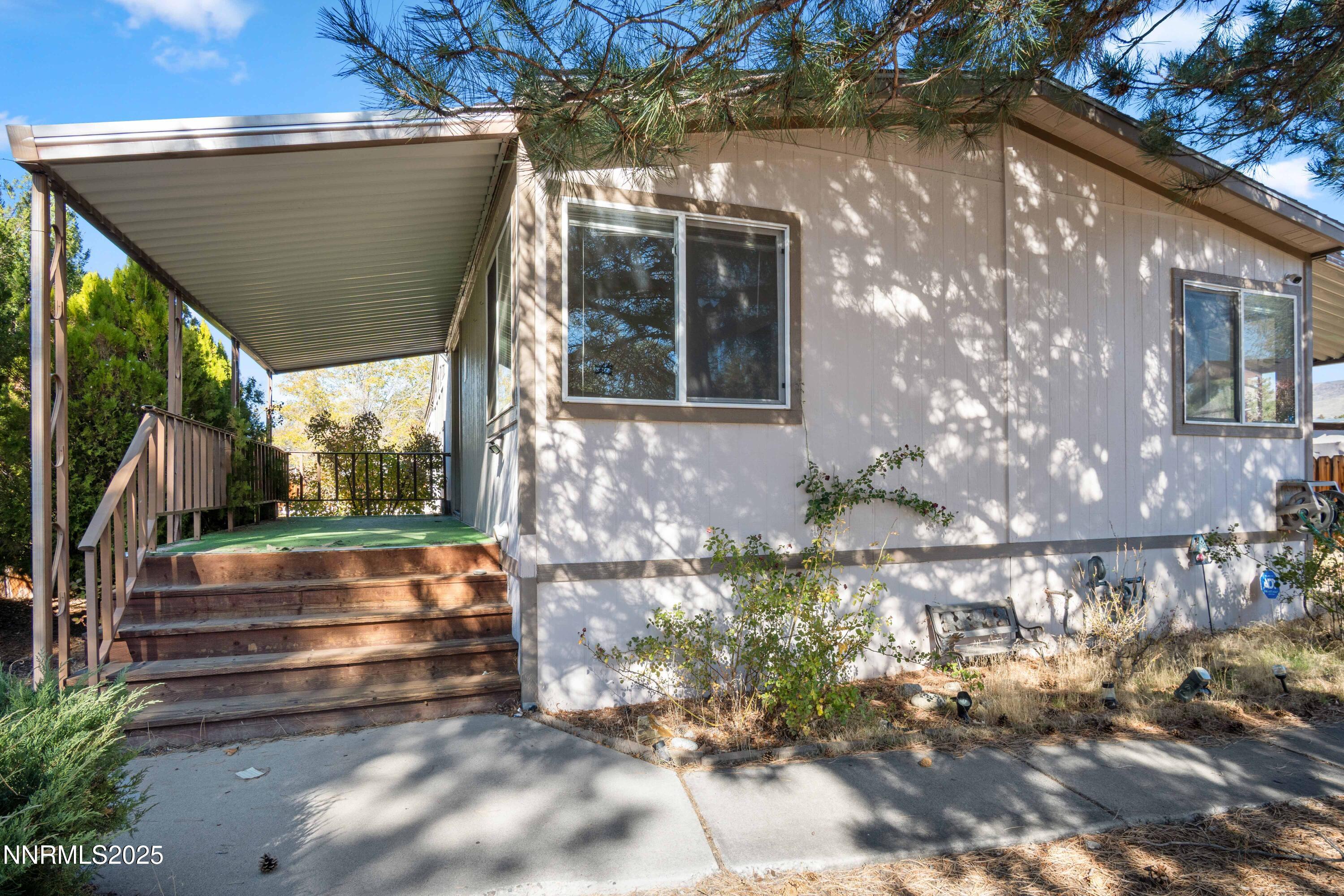 a view of house with backyard