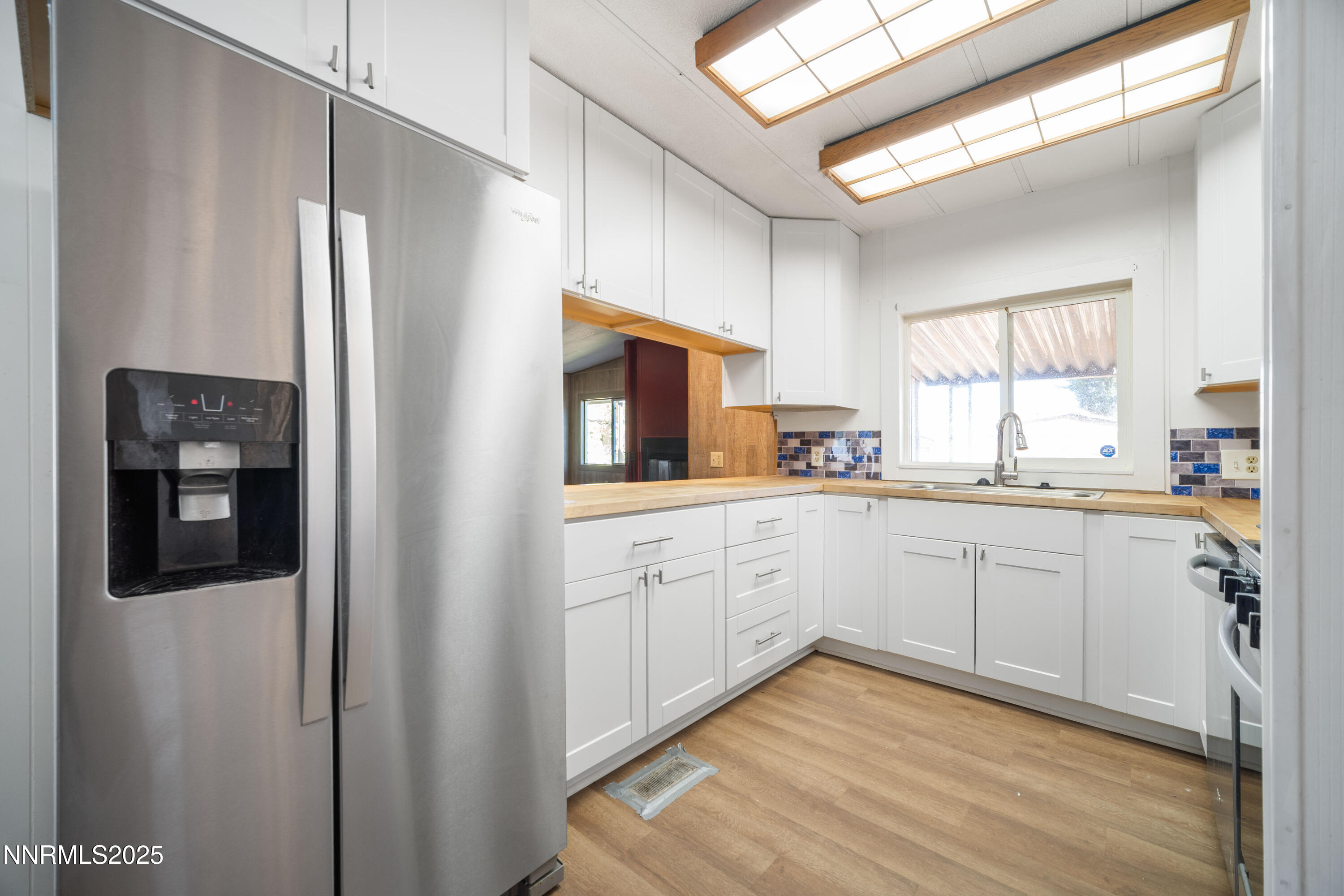 2524 Sneddon Way Carson City, NV 89706 - Photo 11 of 34 a kitchen with cabinets oven and a window