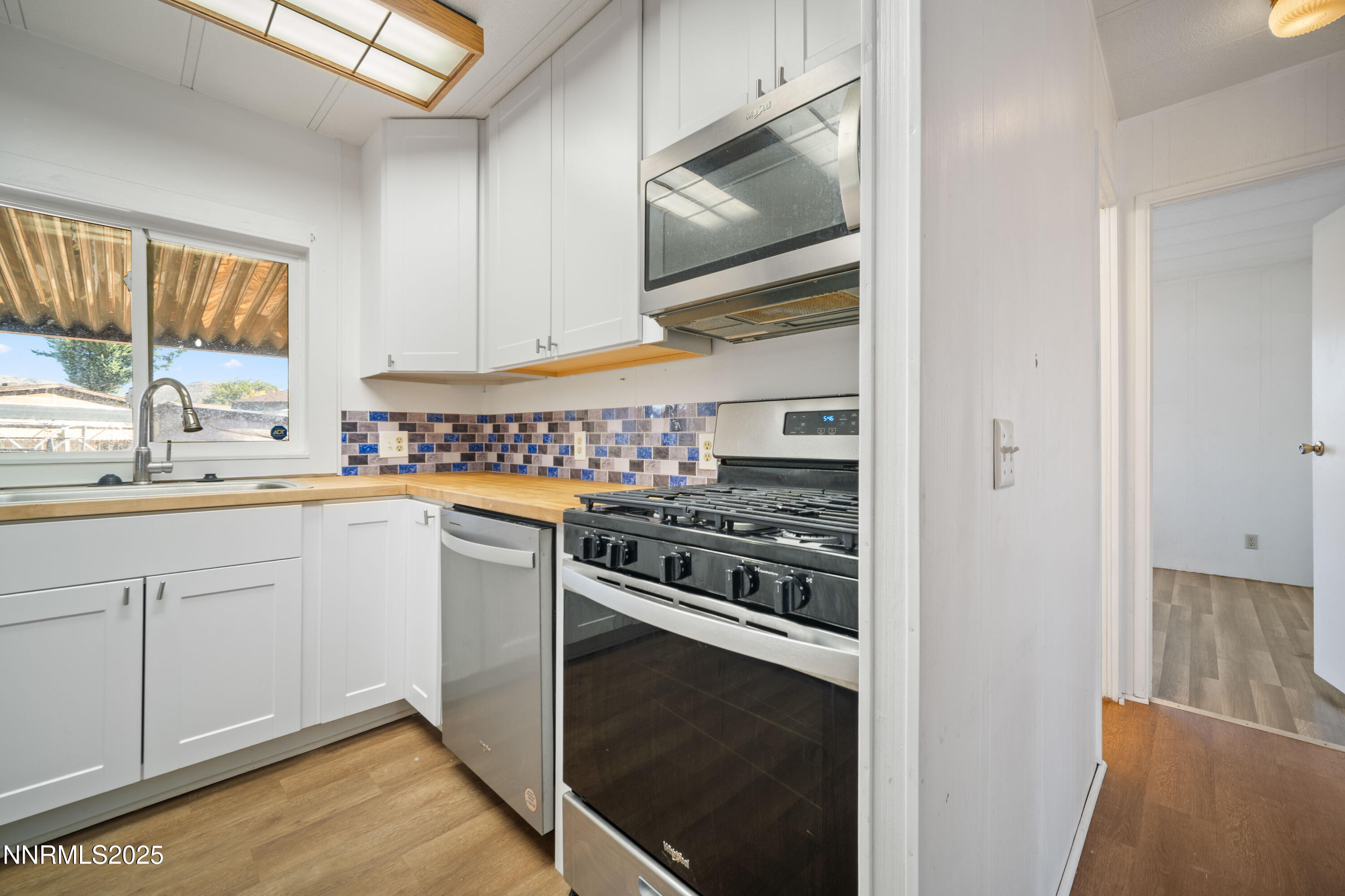 2524 Sneddon Way Carson City, NV 89706 - Photo 12 of 34 a kitchen with a stove oven and sink