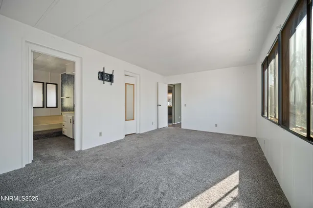a bathroom with a granite countertop sink and a bathtub