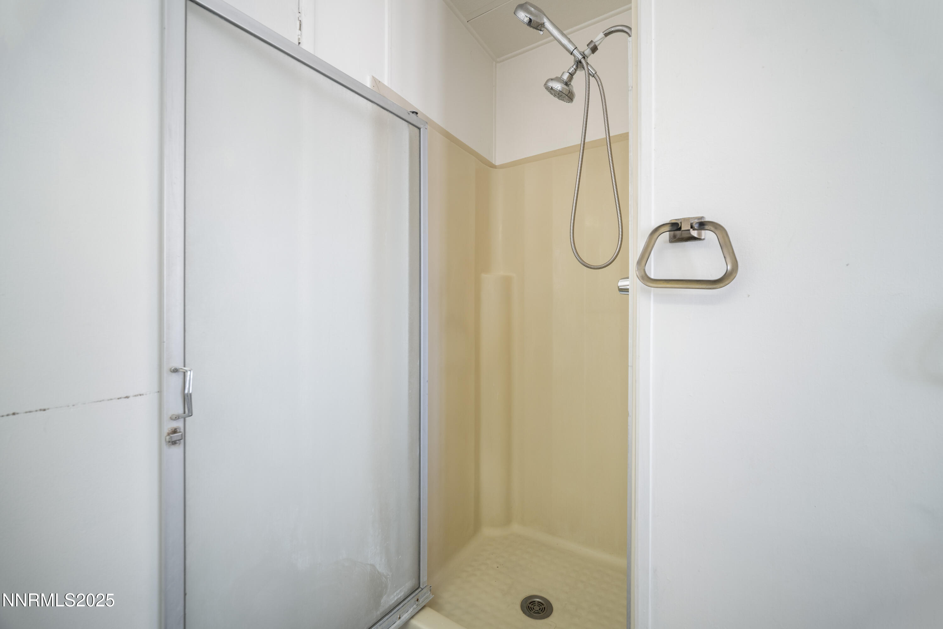 2524 Sneddon Way Carson City, NV 89706 - Photo 17 of 34 a bathroom with a glass shower door