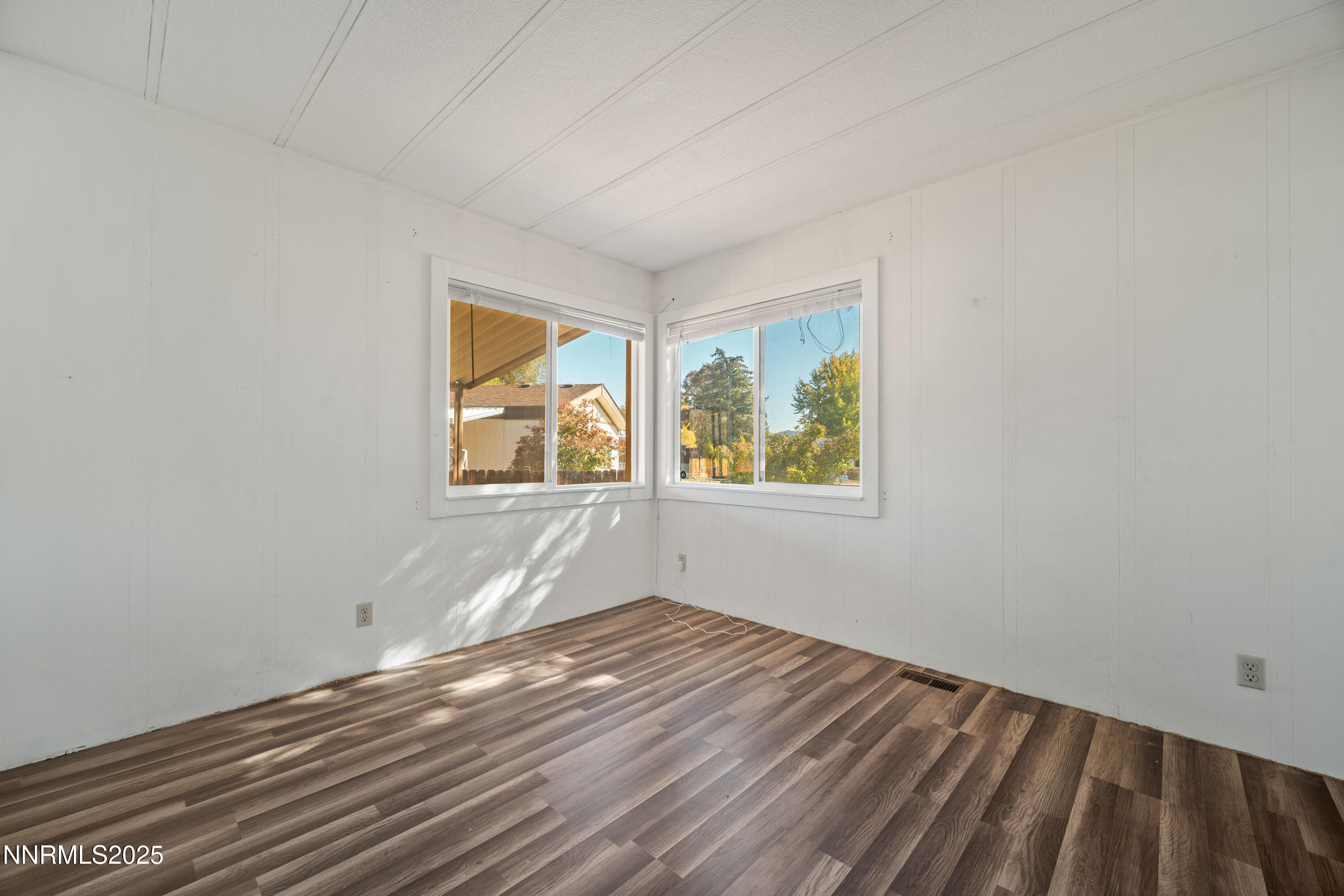2524 Sneddon Way Carson City, NV 89706 - Photo 18 of 34 an empty room with wooden floor and windows