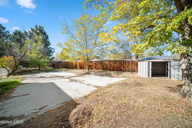 a house view with a backyard
