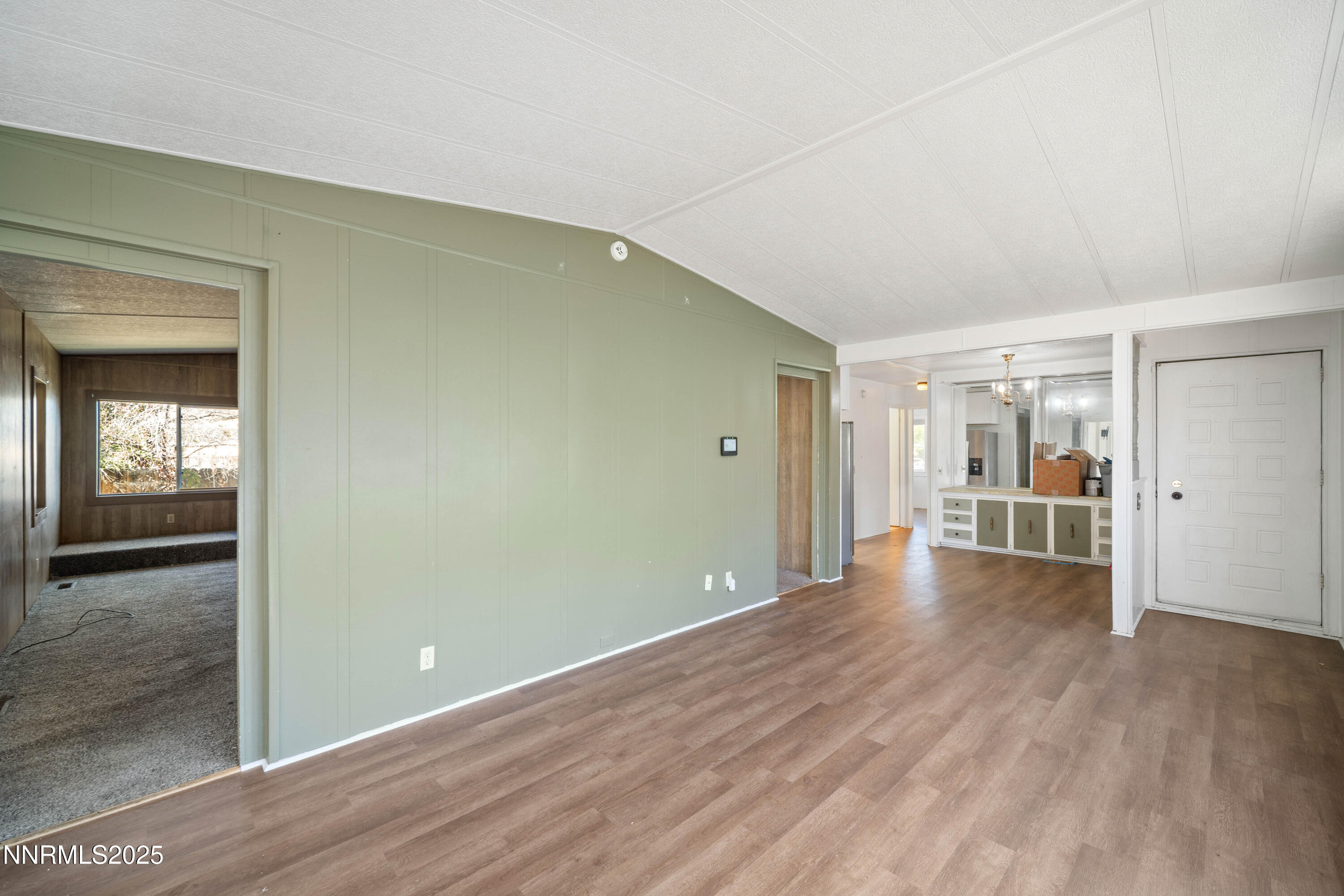 2524 Sneddon Way Carson City, NV 89706 - Photo 5 of 34 a view of a big room with wooden floor and windows