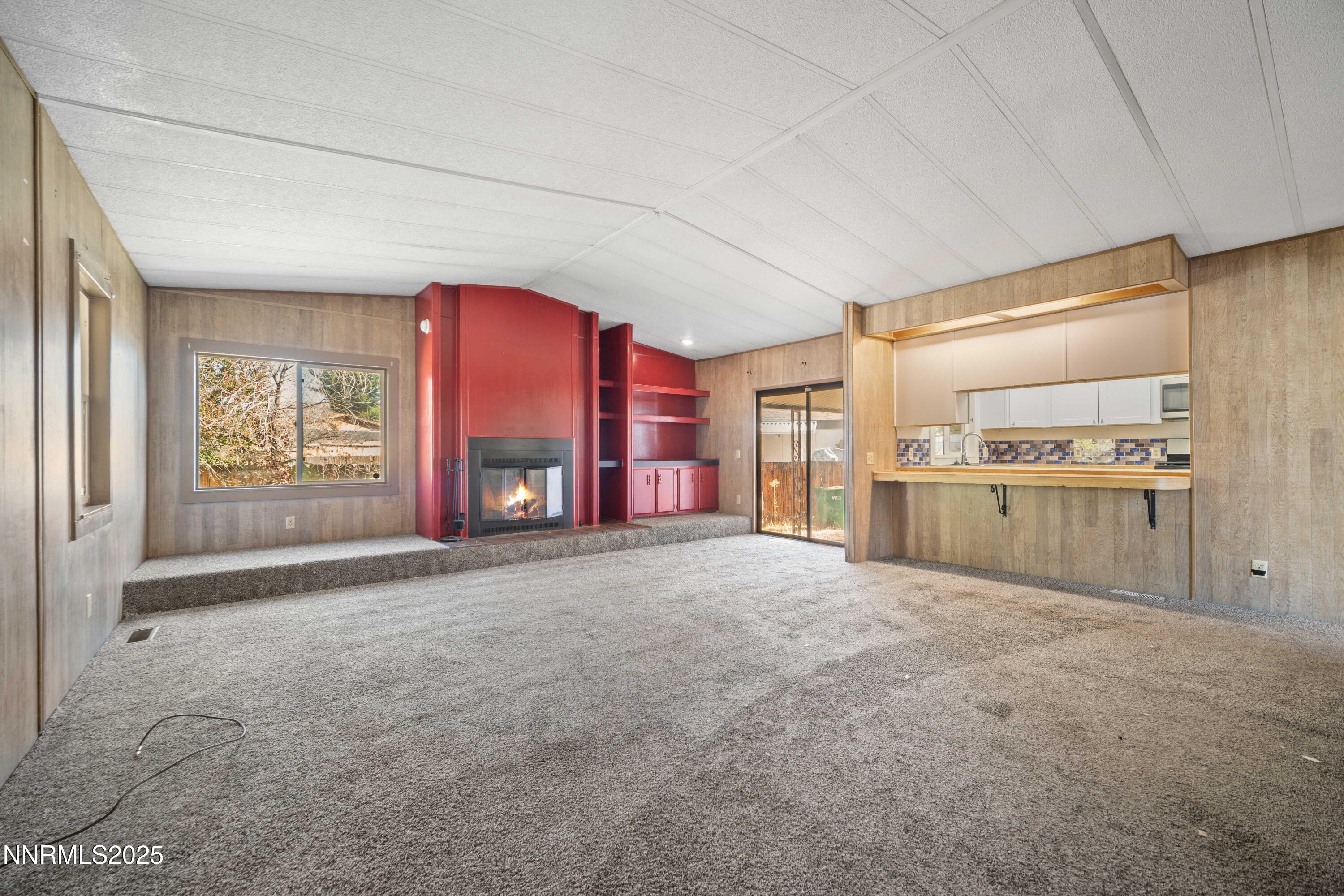2524 Sneddon Way Carson City, NV 89706 - Photo 6 of 34 a big room with windows and a fireplace