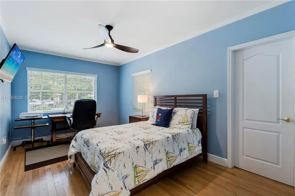 a bed room with a bed and a chair