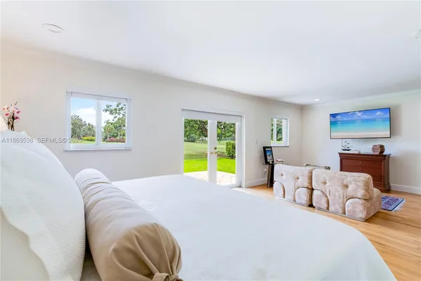 a bedroom with a bed and a couch